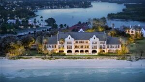 A Naples waterfront estate returns to the market at $195 million after a $100 million price cut; why one of America’s most expensive homes still hasn’t found a buyer