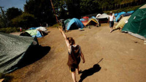 10-year-old Seattle boy lived in a tent while his mother battled fentanyl addiction; after an 11-month rescue effort, he entered school for the first time and said, ‘I want to go back’