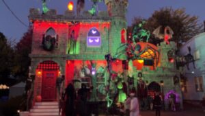 A Boston couple spent months wrapping their ordinary home in hand-carved foam to create a Dracula-style castle for Halloween 2026, and their free display has drawn visitors from other states and 70,000 video views