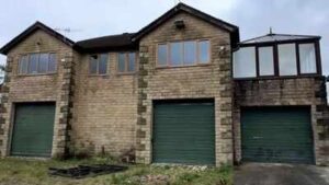 A couple bought a derelict Land Rover dealership for £330,000 and turned it into a five-bedroom home; the forecourt can fit around 50 cars | World News