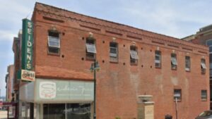 Kansas City building dating to 1874 faced emergency demolition after part of its roof collapsed; a developer stepped in, and the former fur shop is now being turned into a restaurant and apartments